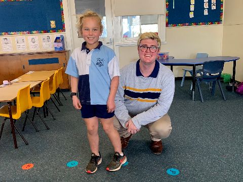 Ed Smith pictured in the classroom with one of his primary school students