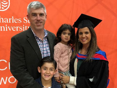 Orange graduate Jenna Hattersley with her husband and two children