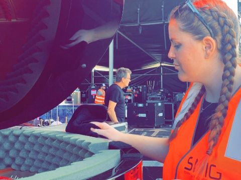 Miss Taylor buffing piano before concert