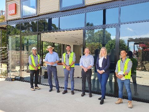 Minister Andrew Gee with two Medicine students and staff from the construction site at the Orange campus 